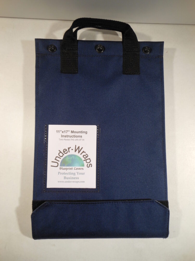 A blue bag with a handle and a label.