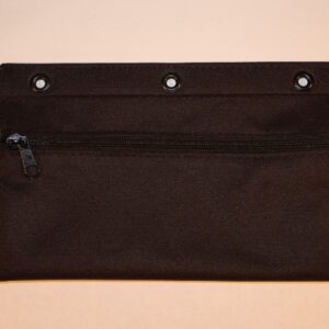 A black bag with three holes on the front.