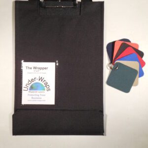 A black bag with some papers and a key chain