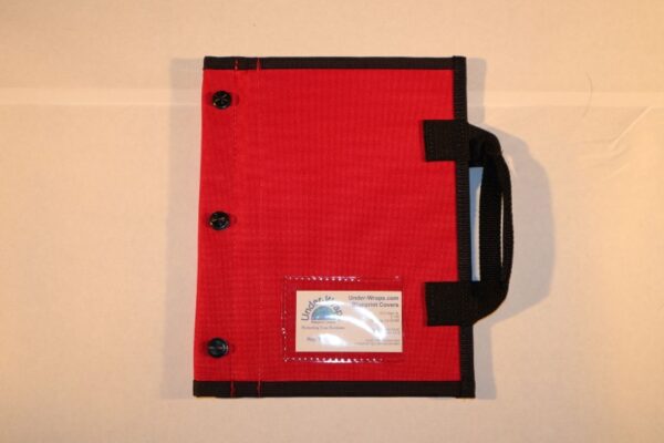 A red and black folder with some papers inside