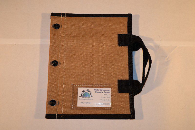 A brown and black folder with a handle
